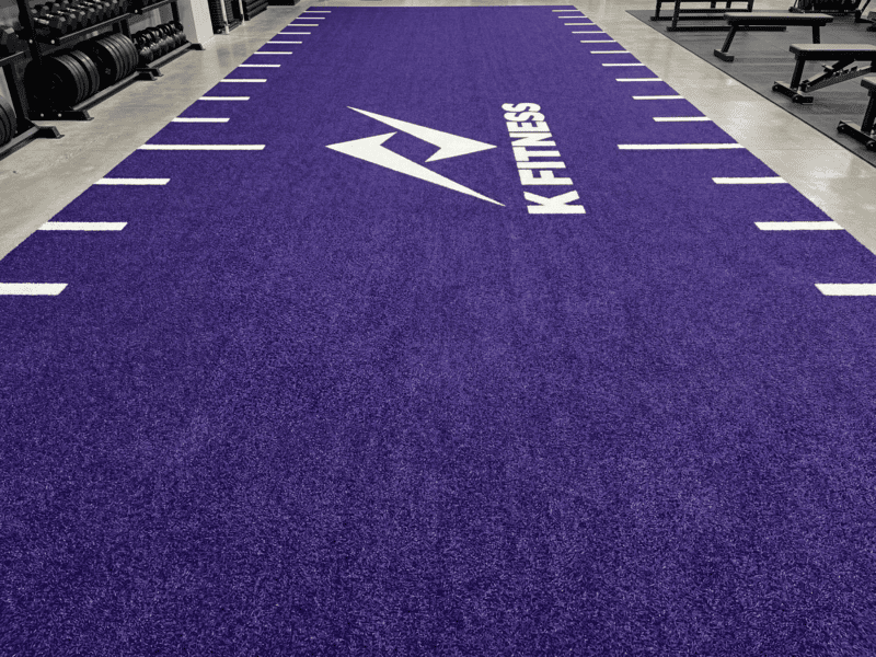 sled pushing on uneven gym turf